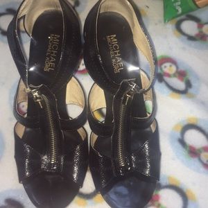 Michael Kors black zip up heels used.